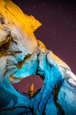 Sandstone formations in Montana painted with light at night.