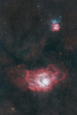 The Lagoon and Trifid nebulas captured with a telescope and a defiltered camera.