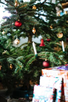 Christmas xmas tree with decoration balls fairy lights and gifts 