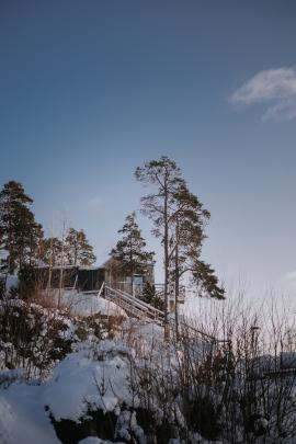 Winter sunset house in the forest