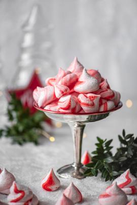 Peppermint Meringues in a silver compote surrounded by a winter decor