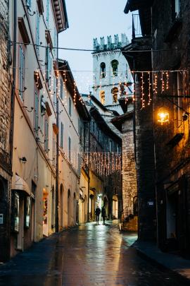 A medieval street decorated for Christmas in the town of Assisi, Umbria, Italy, the birthplace of St Francis of Assisi