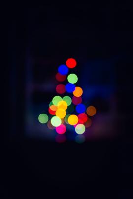 Colorful blurry lights on a Christmas tree.