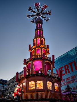 A tower in the middle of the stuttgarter christmas market glowing in the afternoon!