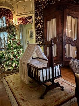Christmas the Louis XV room that includes a baby cradle at the Biltmore House in Asheville, NC.