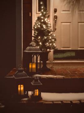 Our front porch decorated with some Christmas inspired lanterns and decor. There’s also some real snow coating the steps and lanterns! 