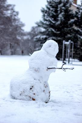 Snowman in snow.