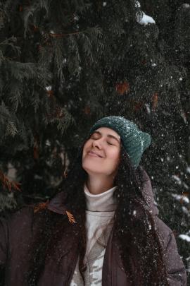 Snow falls on the girl's face