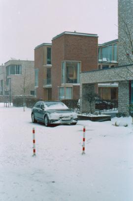 car hidden by snow in winter