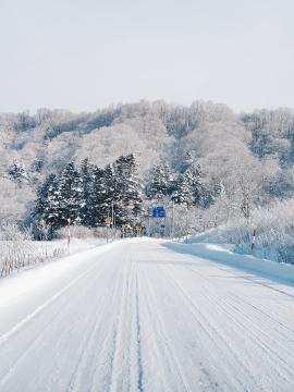 View of a road covered in snow in Hokkaido, Japan.