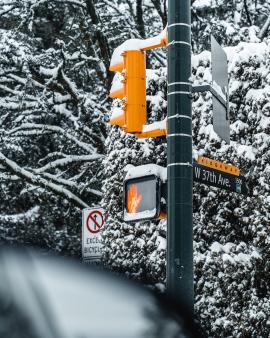 Traffic light with snow in the city of Vancouver, British Columbia, Canada