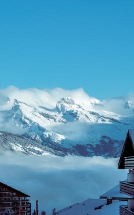 A village view from Haute Nendaz, looking over the cloud covered Vallais Valley