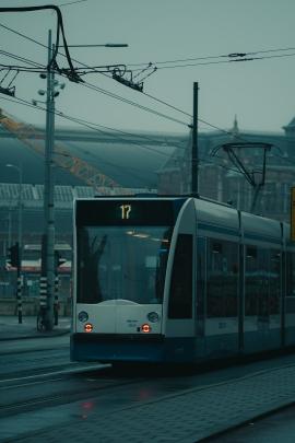 A tram in Amsterdam on a cloudy and cold day during the winter of 2020.