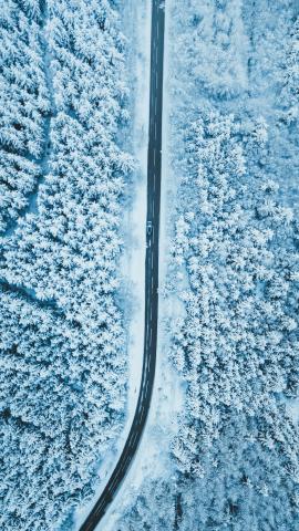 Snowy Welsh road from drone, Audi SQ5 down below. 