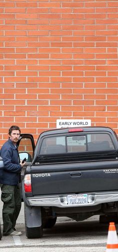 Christian Bale with his Toyota iPhone Wallpaper